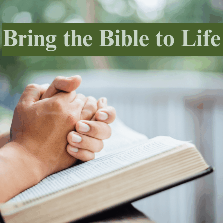 Hands folded on Bible